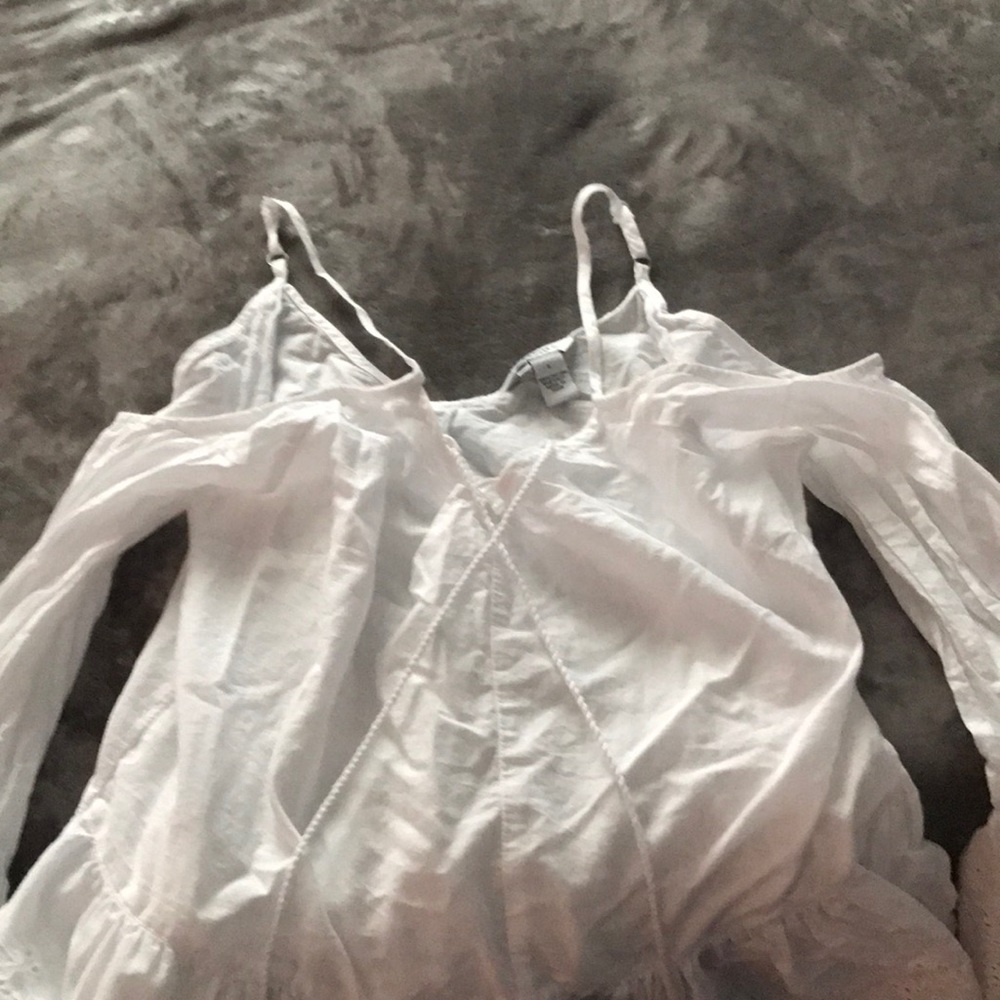 While ruffled shoulder cut out blouse